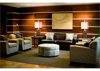 cozy lounge area with sofas and lamps