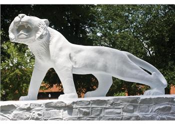 sculpture of a white tiger on a pedestal