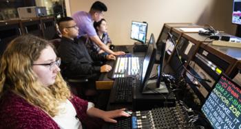 students working on broadcast equipment