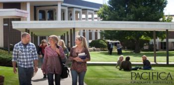 students walking, 'PACIFICA GRADUATE INSTITUTE' sign