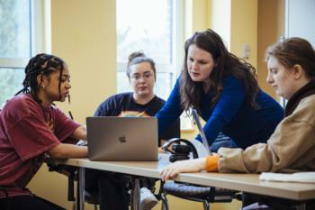 group study session around a laptop