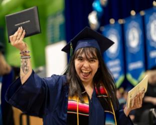 College of Lake County graduate with diploma