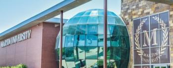 martin university building with glass dome and signage