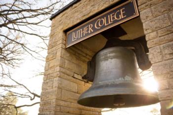 bell with 'luther college' sign above it