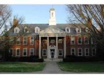 brick building with white cupola