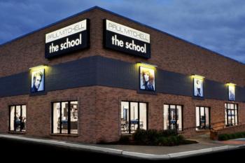 exterior of 'paul mitchell the school' at dusk