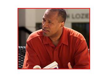 man in red shirt speaking