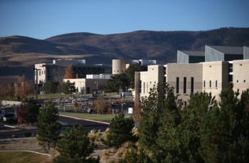 modern buildings with hills in the background