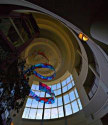 interior view of a building atrium with hanging art and circular design