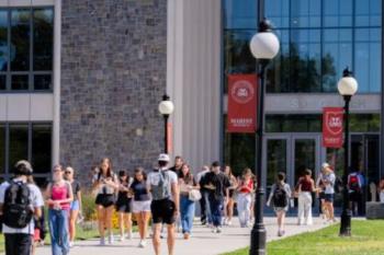 Students walking on campus heading to class.