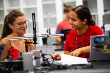 students in lab with equipment and computers