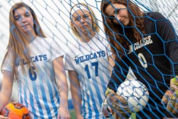soccer players in blue and white uniforms