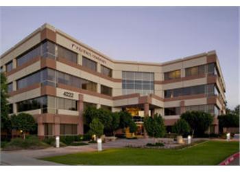 modern building at dusk with landscaping