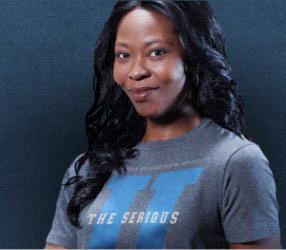 smiling person in 'the serious' t-shirt